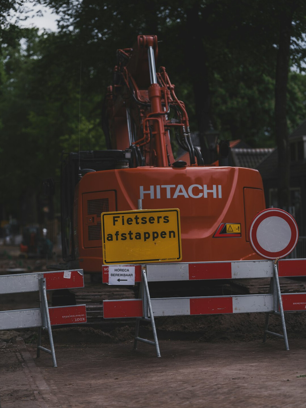 Road construction site with machinery and barriers