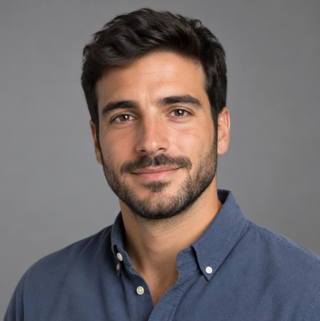 Studio portrait of a Portuguese man data journalist in his 30s