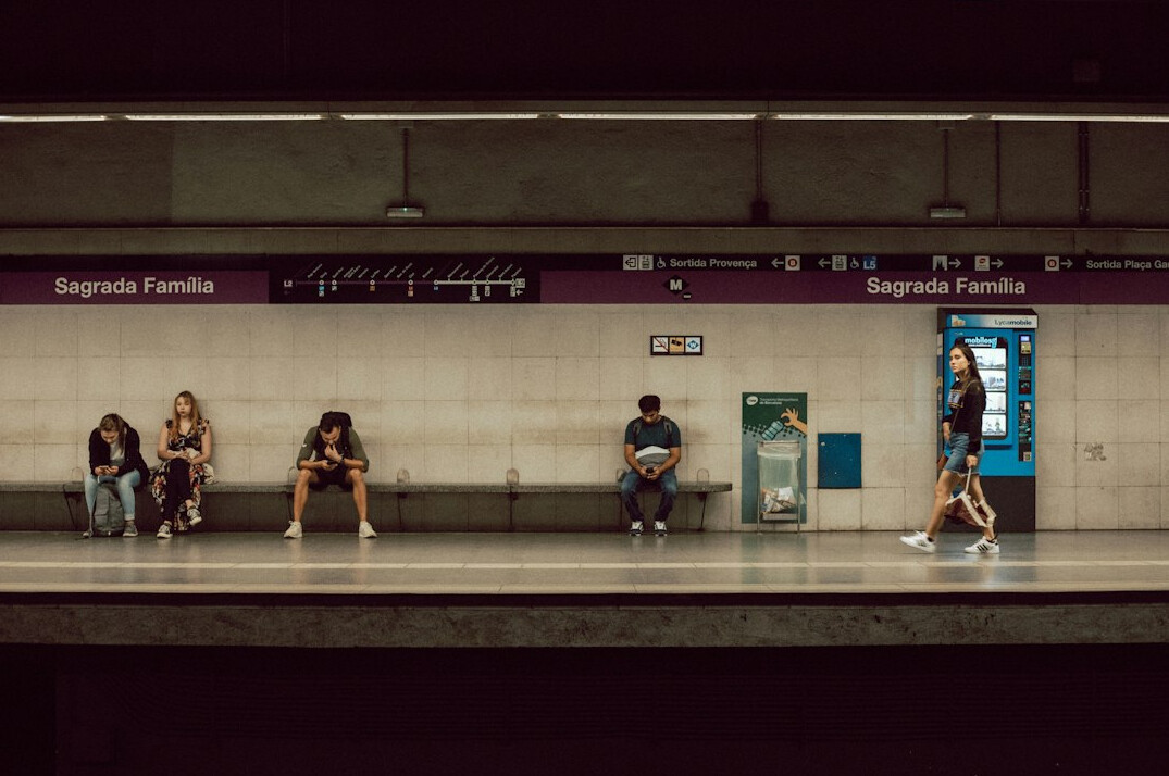 Passengers waiting on a public transport train platform